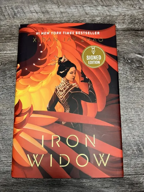 A Chinese woman with her hair in an intricate bun stares our from the cover, surrounded by the massive wings of a read bird
